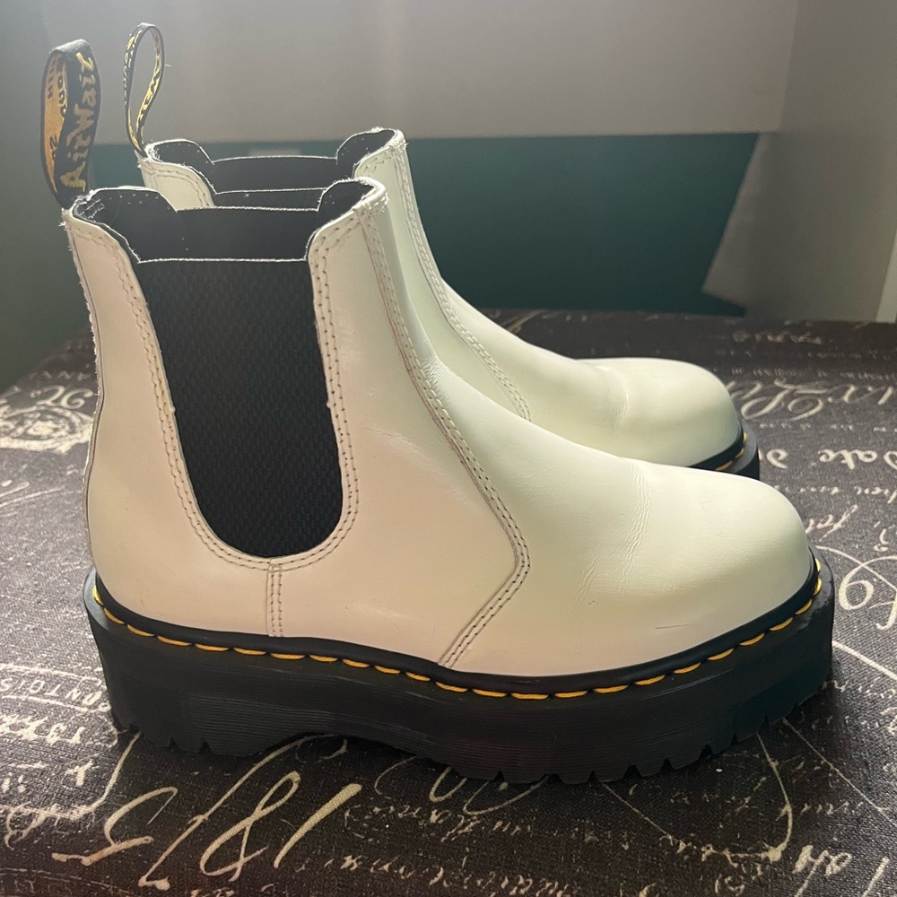 Woman’s white doc martens
